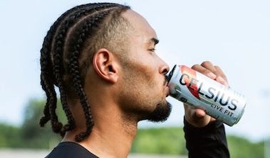 Athlete drinking from a can of Celsius energy drink