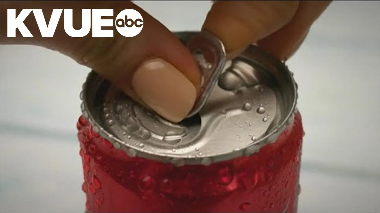 KVUE report: a hand opening a canned drink